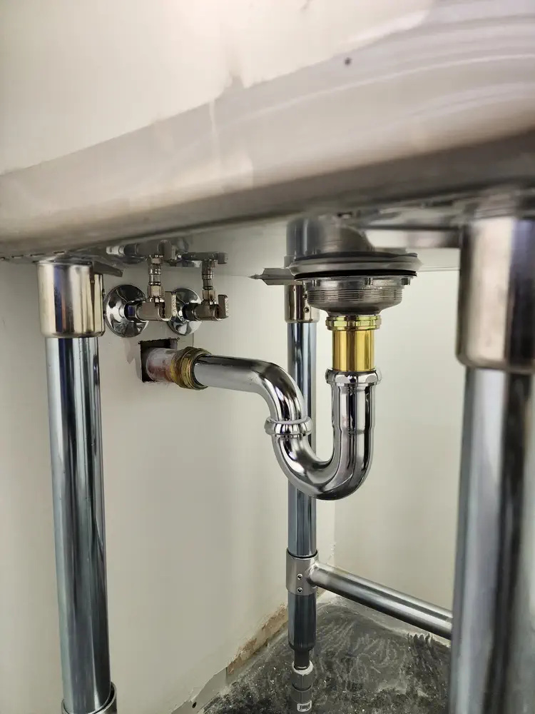 Exposed chrome sink plumbing